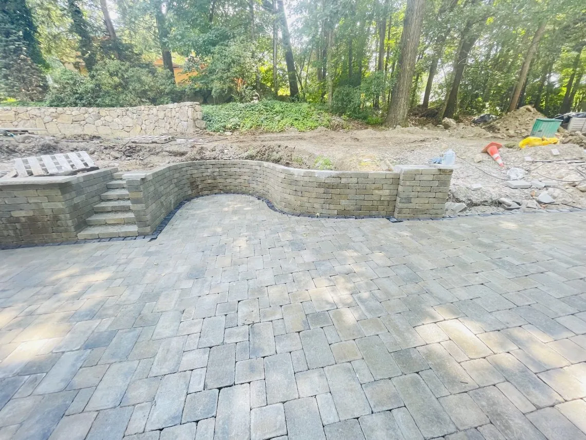 Curved stone patio and retaining wall project